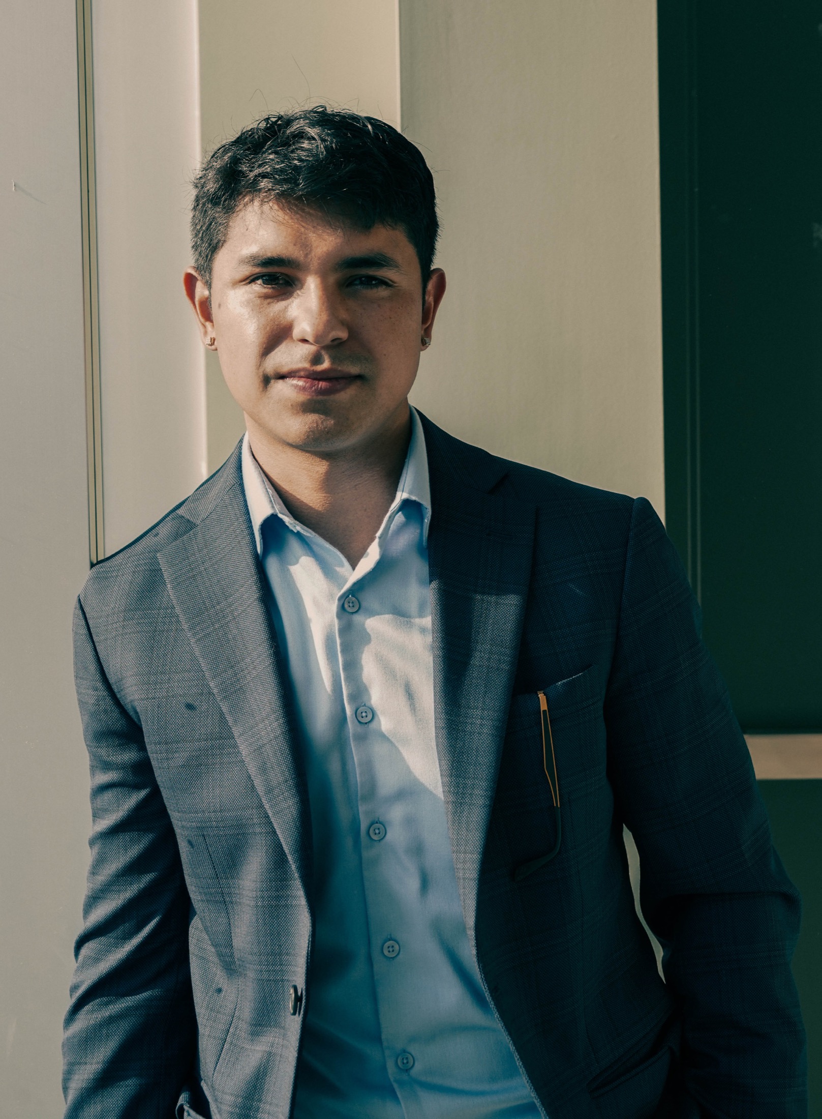 Portrait of Anthony Huete-Jacobs in a suit